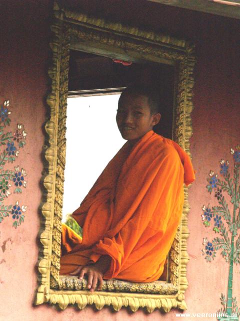Laos - Monk in window frame